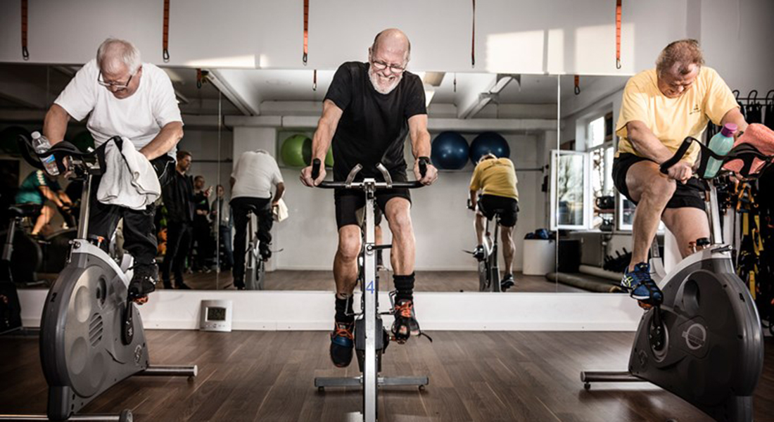 Men training on bikes